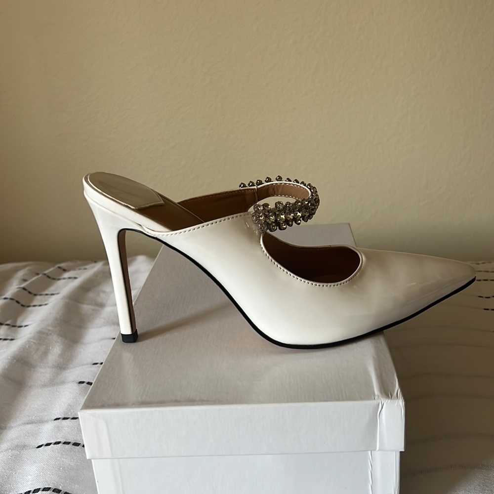 New. Never worn white pump mules with rhinestones